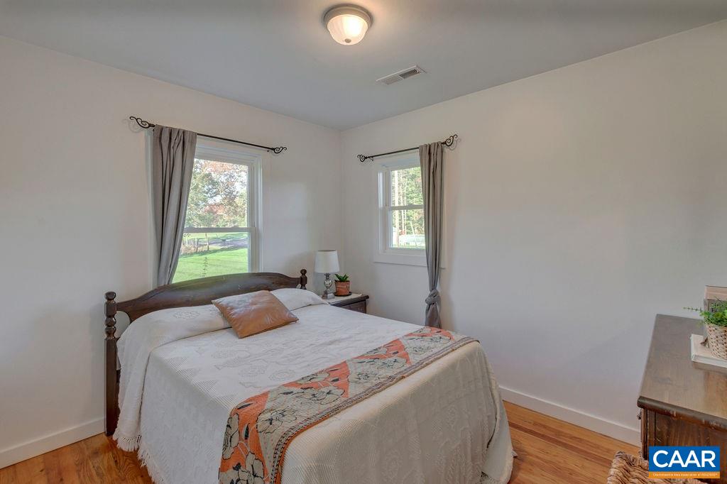 404 Blue Run Road Stanardsville, VA 22973 - Photo 35 of 43 a bedroom with a bed and a window