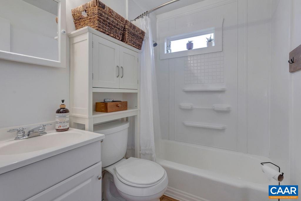404 Blue Run Road Stanardsville, VA 22973 - Photo 36 of 43 a bathroom with a sink a toilet and shower