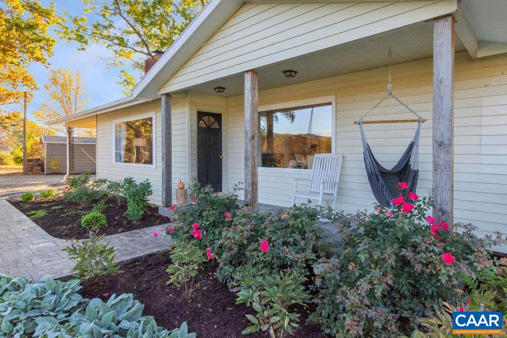404 Blue Run Road Stanardsville, VA 22973 - Photo 9 of 43 a view of a backyard with flowers