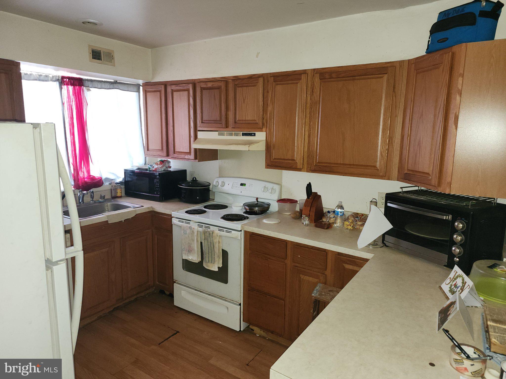 3006 Generals Way Dover, DE 19901 - Photo 5 of 10 Cozy kitchen with warm wooden tones.