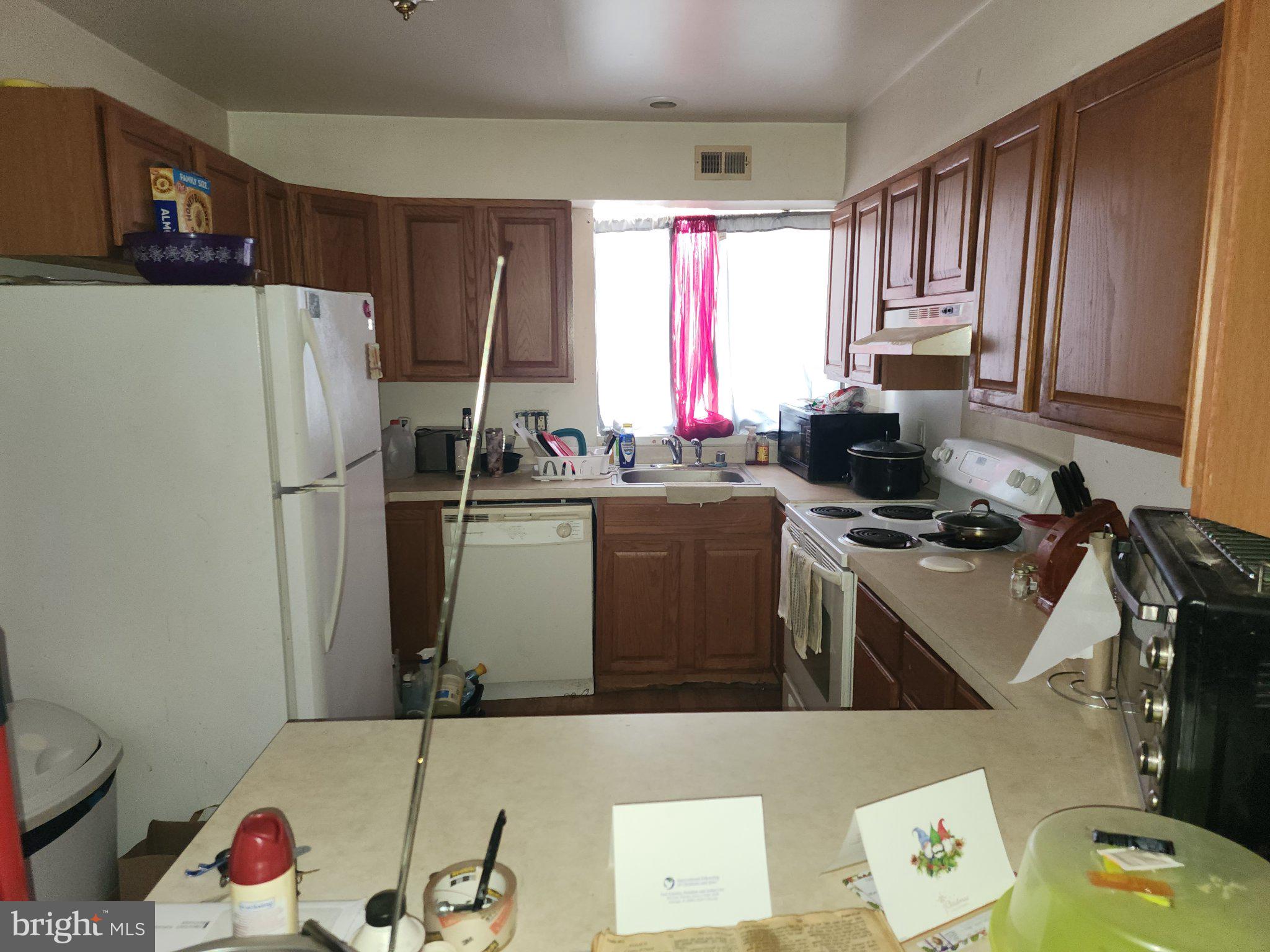 3006 Generals Way Dover, DE 19901 - Photo 6 of 10 Cozy kitchen with warm wooden tones.