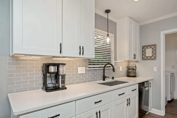 a kitchen with a sink and a window