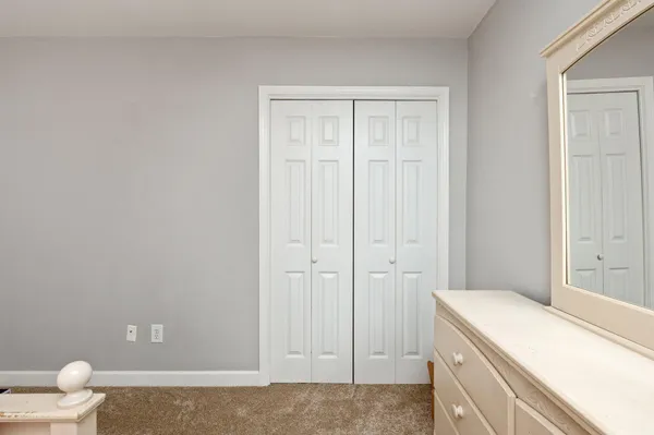 a hallway with a washer and dryer