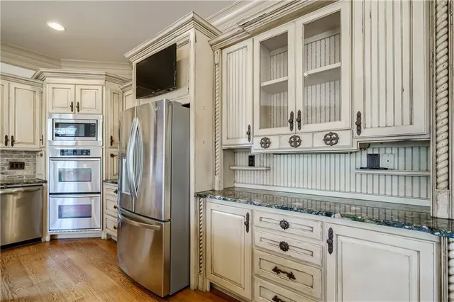 a spacious bathroom with a granite countertop tub sink and mirror