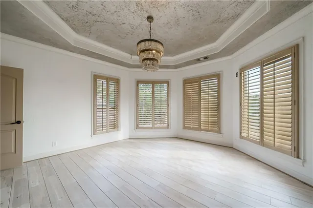 a view of a door with wooden floor