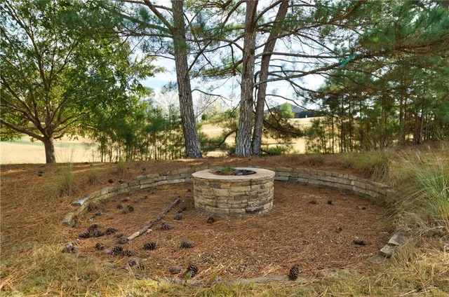 a view of a hallway with wooden floor and entryway