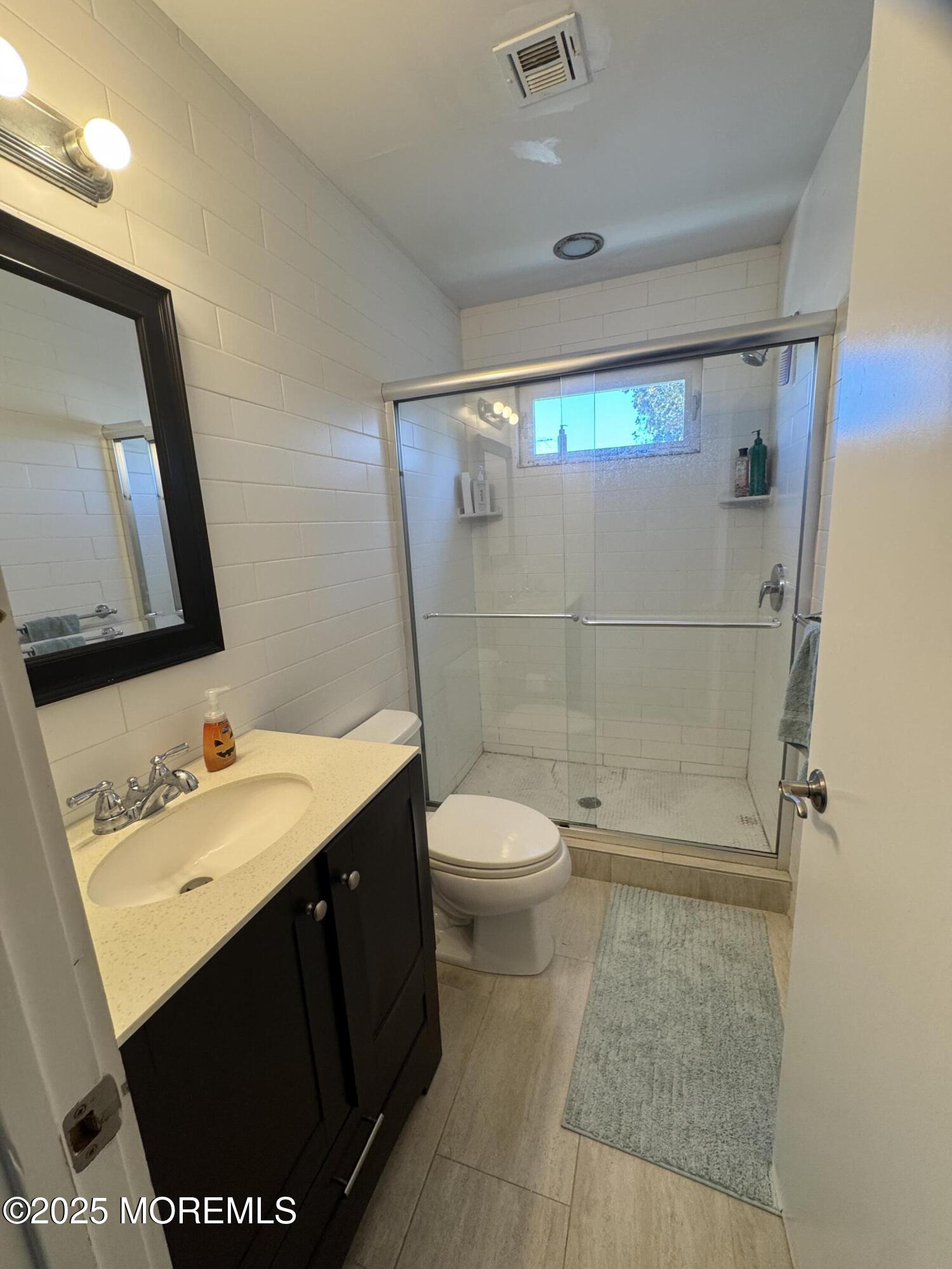 106 Poplar Avenue Deal, NJ 07723 - Photo 6 of 9 a bathroom with a sink toilet and shower
