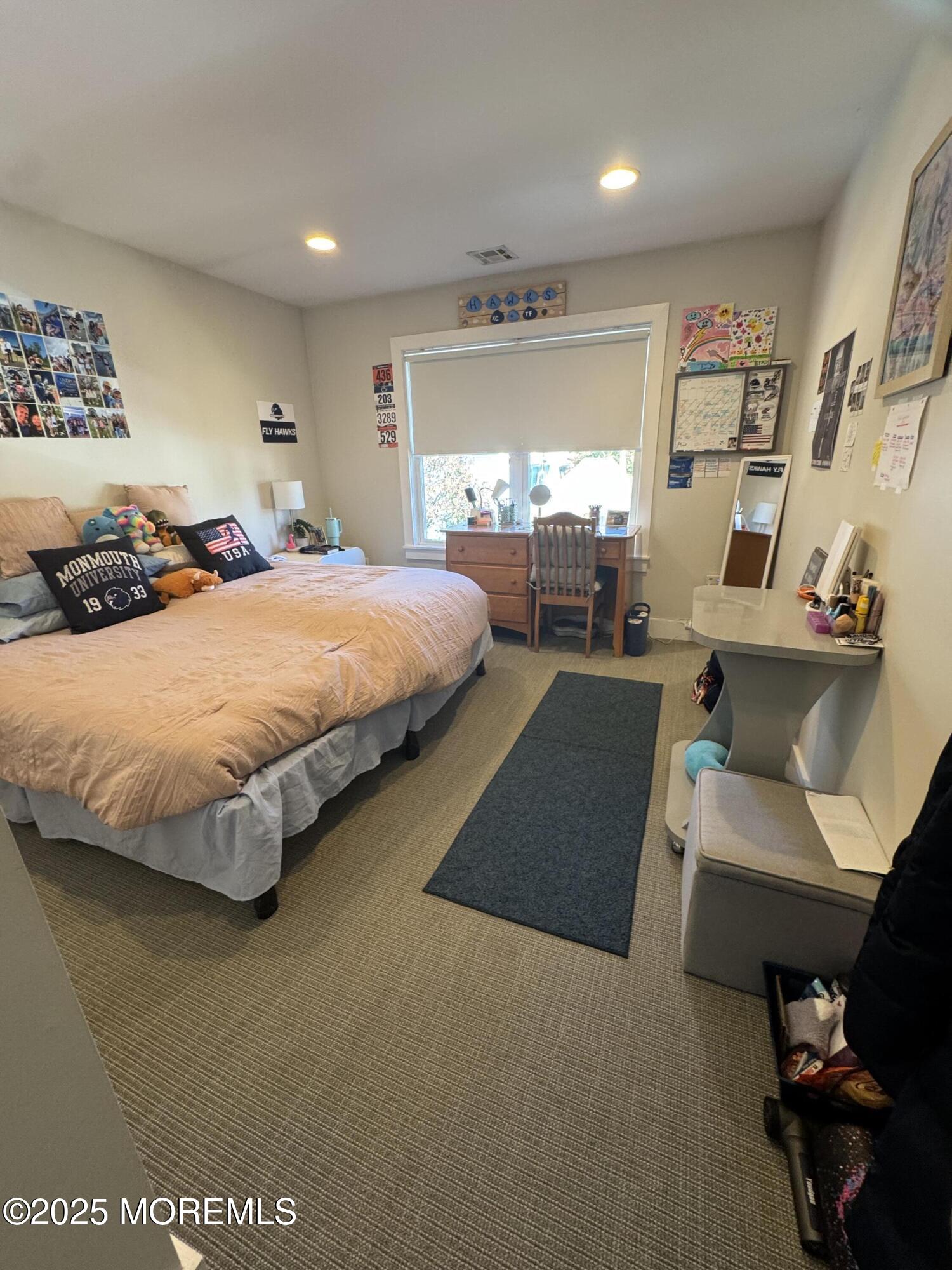 106 Poplar Avenue Deal, NJ 07723 - Photo 7 of 9 a spacious bedroom with a bed and window