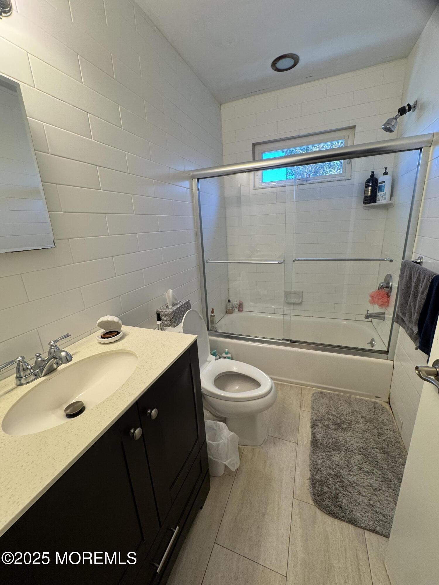 106 Poplar Avenue Deal, NJ 07723 - Photo 8 of 9 a bathroom with a sink and a toilet