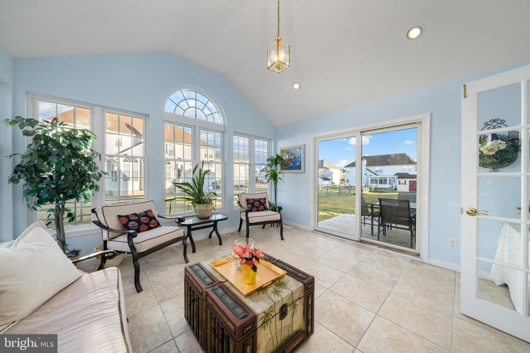 18 Savoy Road Newark, DE 19702 - Photo 11 of 44 a living room with furniture a dining table and a large window