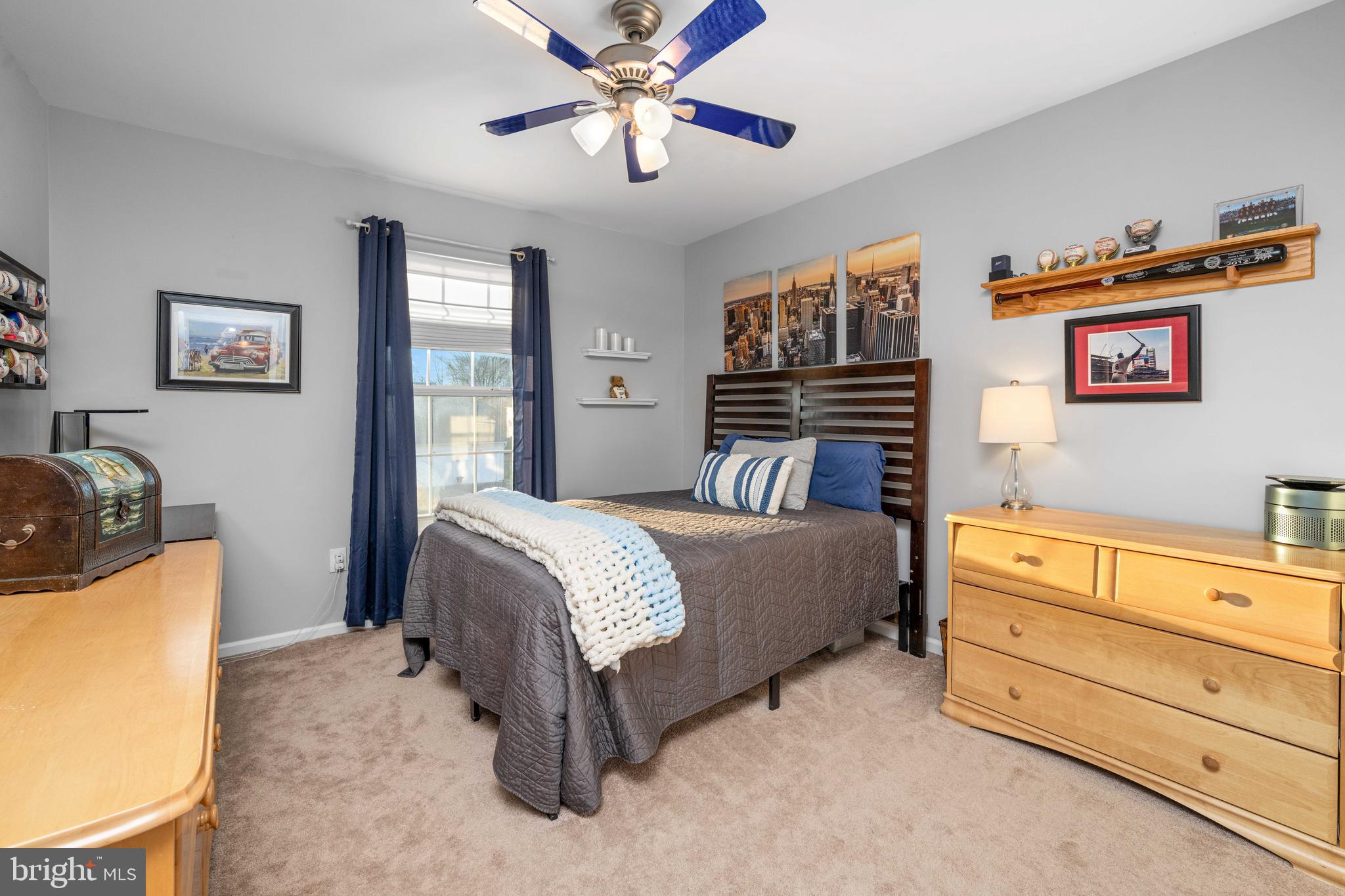 18 Savoy Road Newark, DE 19702 - Photo 27 of 44 a spacious bedroom with a bed and a chandelier