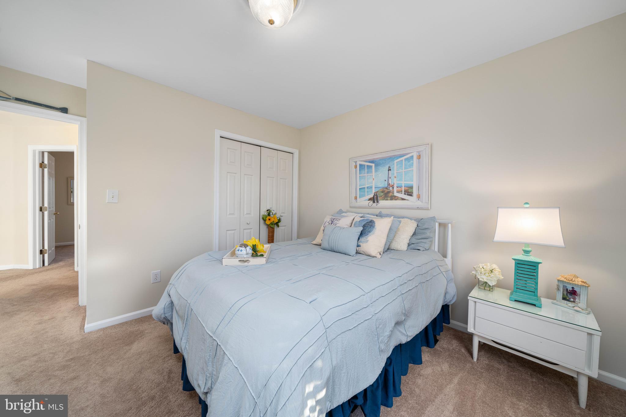 18 Savoy Road Newark, DE 19702 - Photo 30 of 44 a bedroom with a bed and a lamp on table