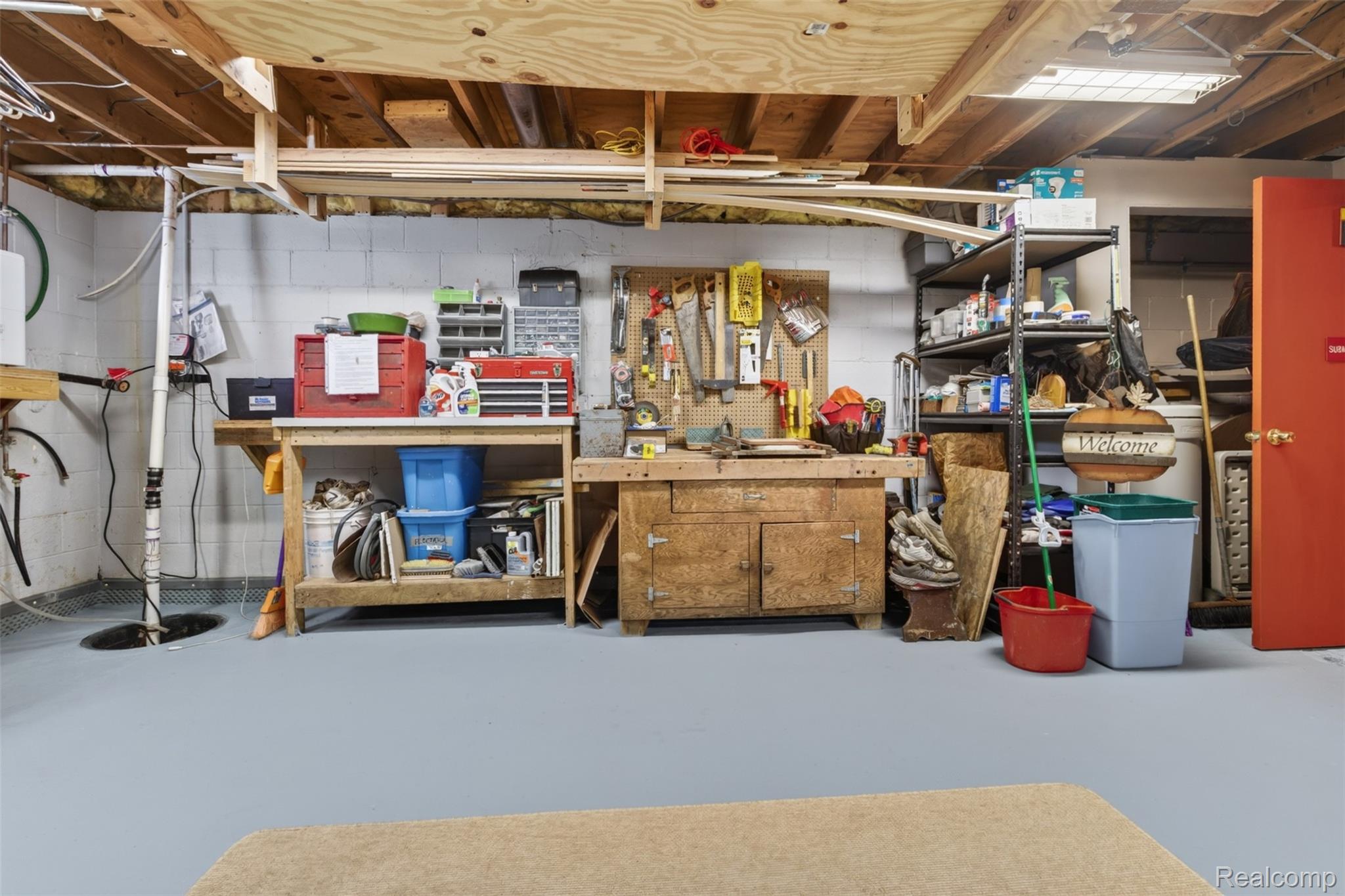 5977 Anglers Road Ortonville, MI 48462 - Photo 32 of 63 Basement workspace featuring concrete block walls and light gray painted flooring