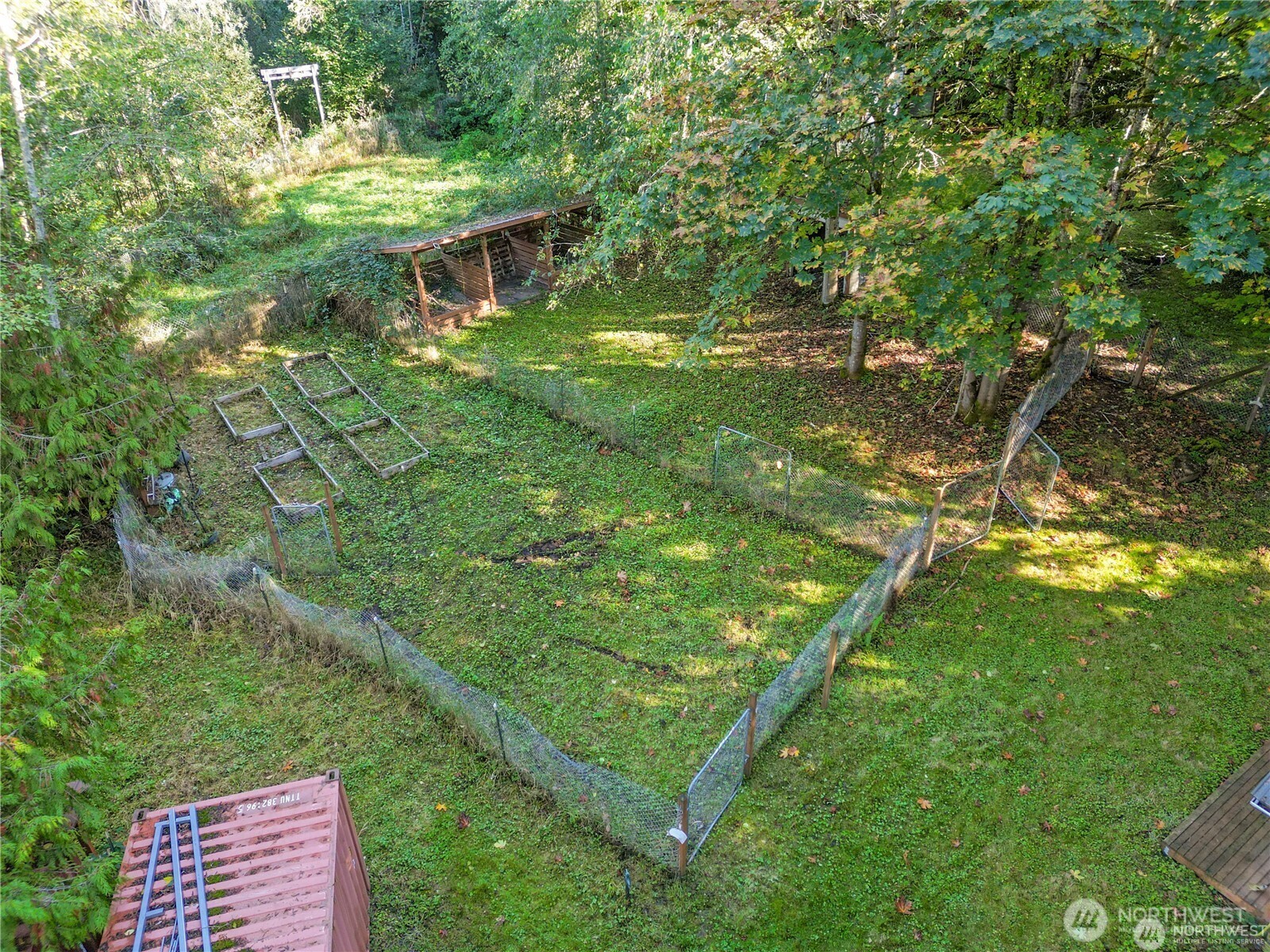 14310 200th Avenue Southeast Renton, WA 98058 - Photo 30 of 39 a backyard of a house with lots of green space and outdoor seating