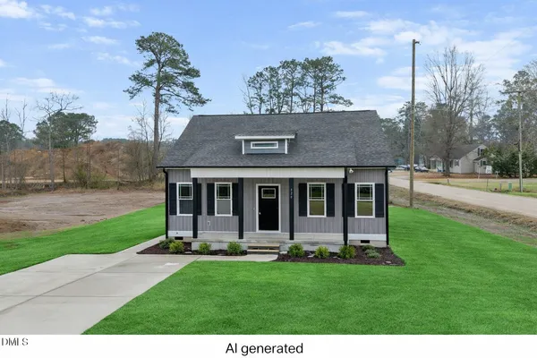 a view of a house with backyard and garden