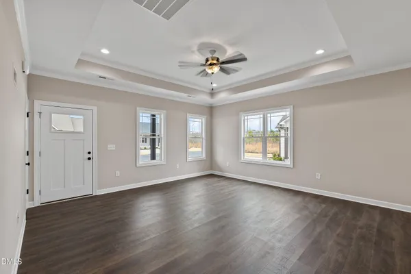 a kitchen with stainless steel appliances granite countertop a sink stove and wooden floor