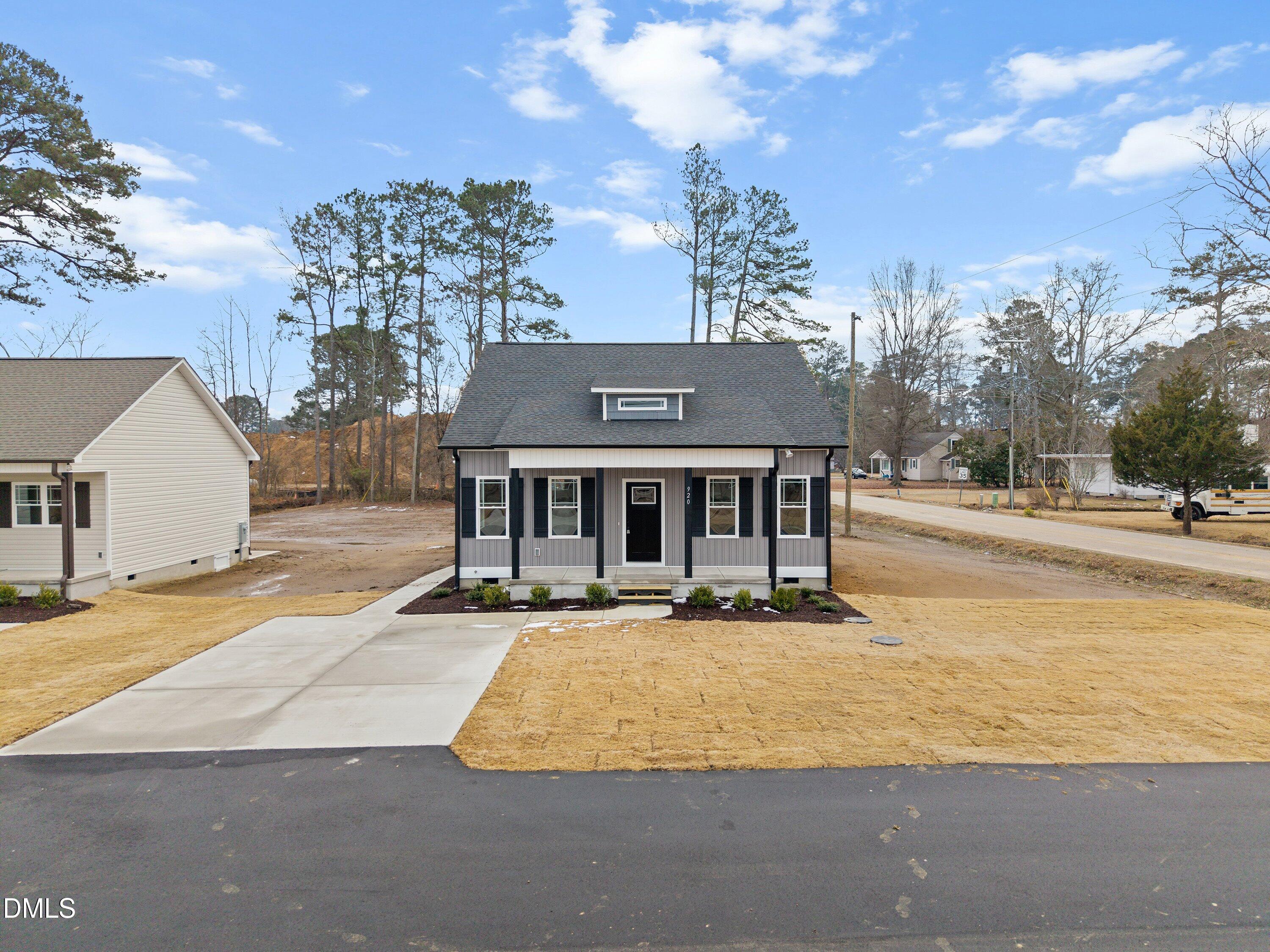 920 Micro Road West Selma, NC 27576 - Photo 2 of 32 a view of a house with yard and sitting area