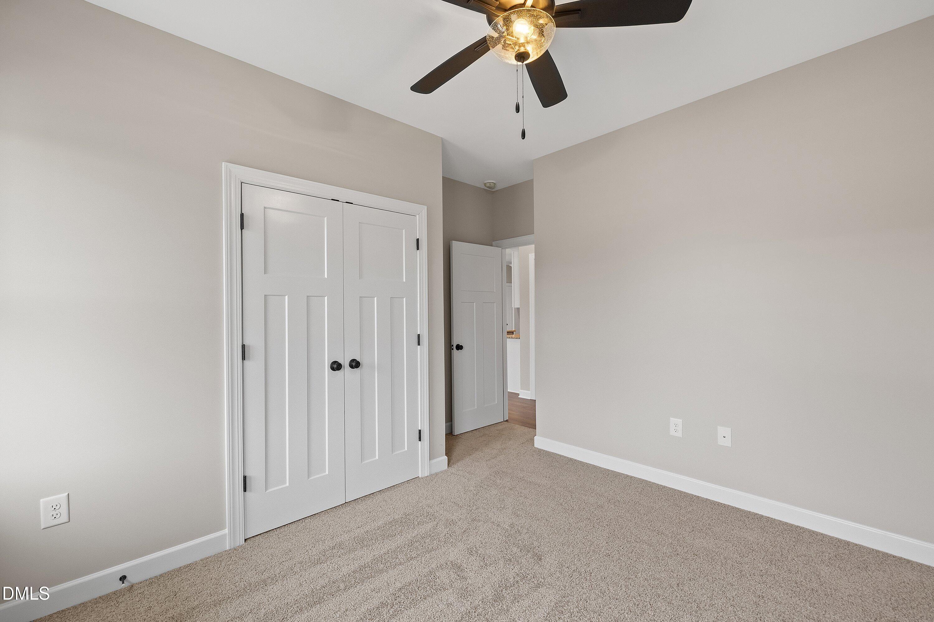 920 Micro Road West Selma, NC 27576 - Photo 24 of 34 an empty room with a empty space and a ceiling fan