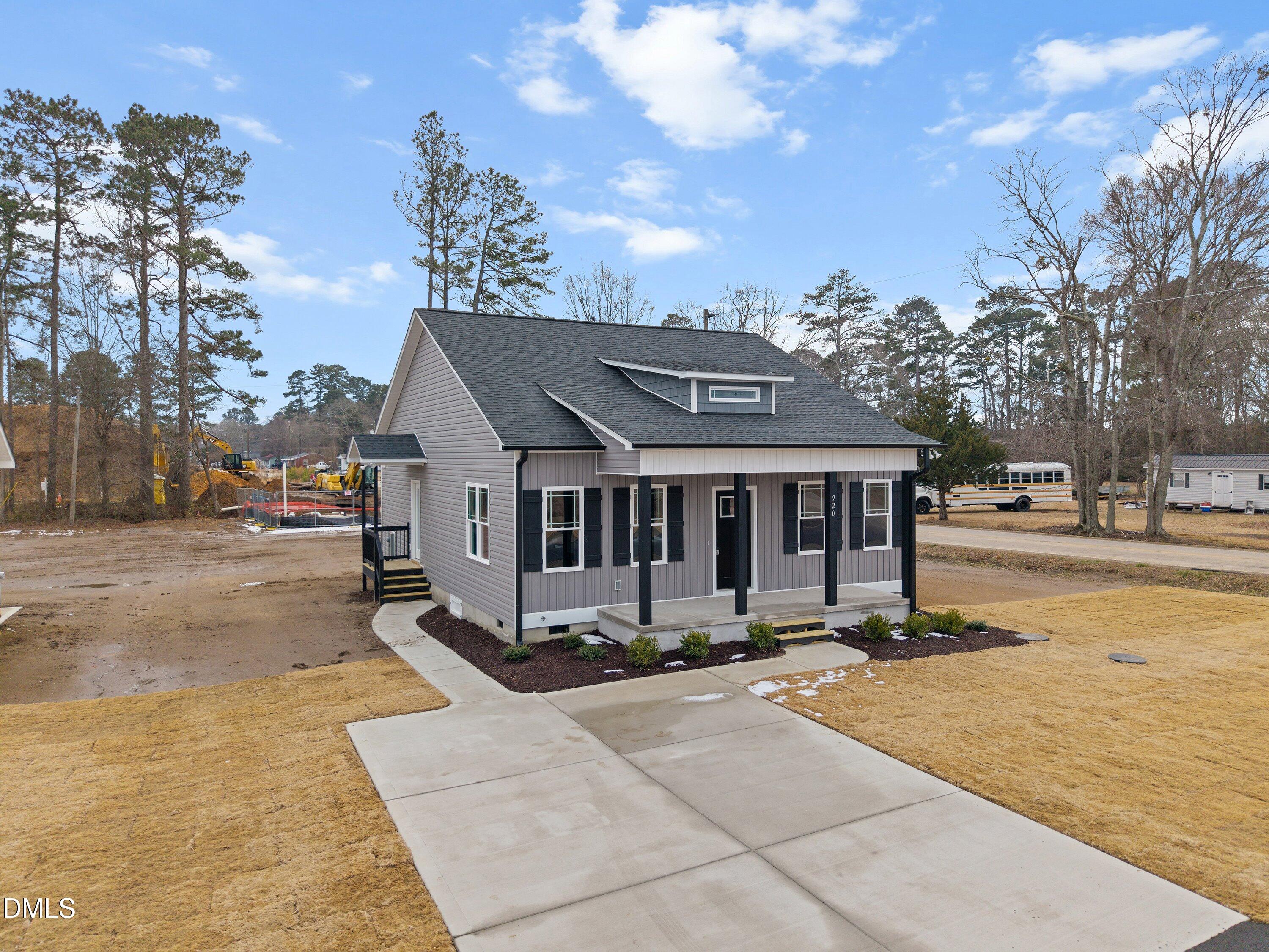920 Micro Road West Selma, NC 27576 - Photo 4 of 32 a view of a building with cars parked on the road