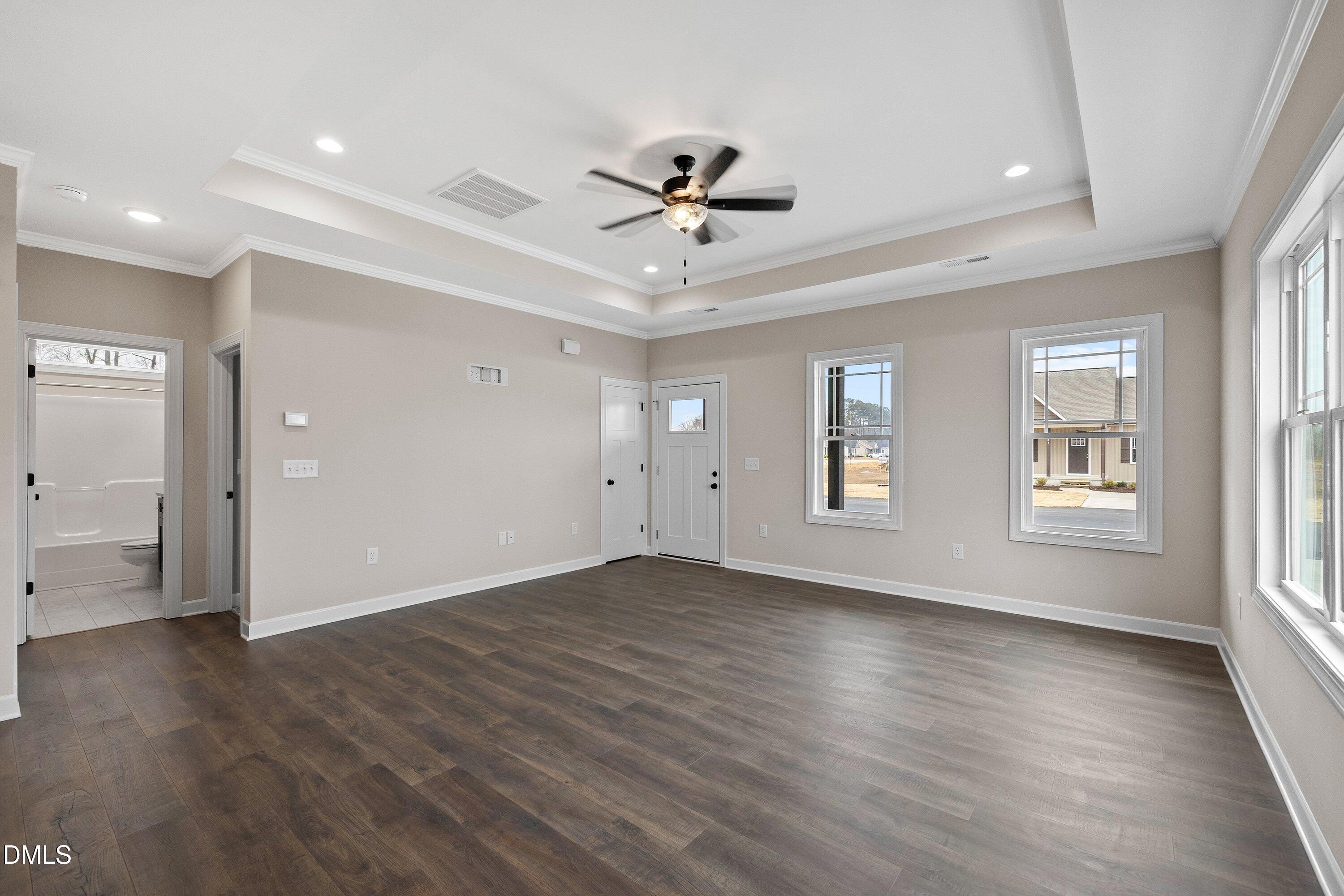 920 Micro Road West Selma, NC 27576 - Photo 8 of 32 a view of an empty room with a window and wooden floor