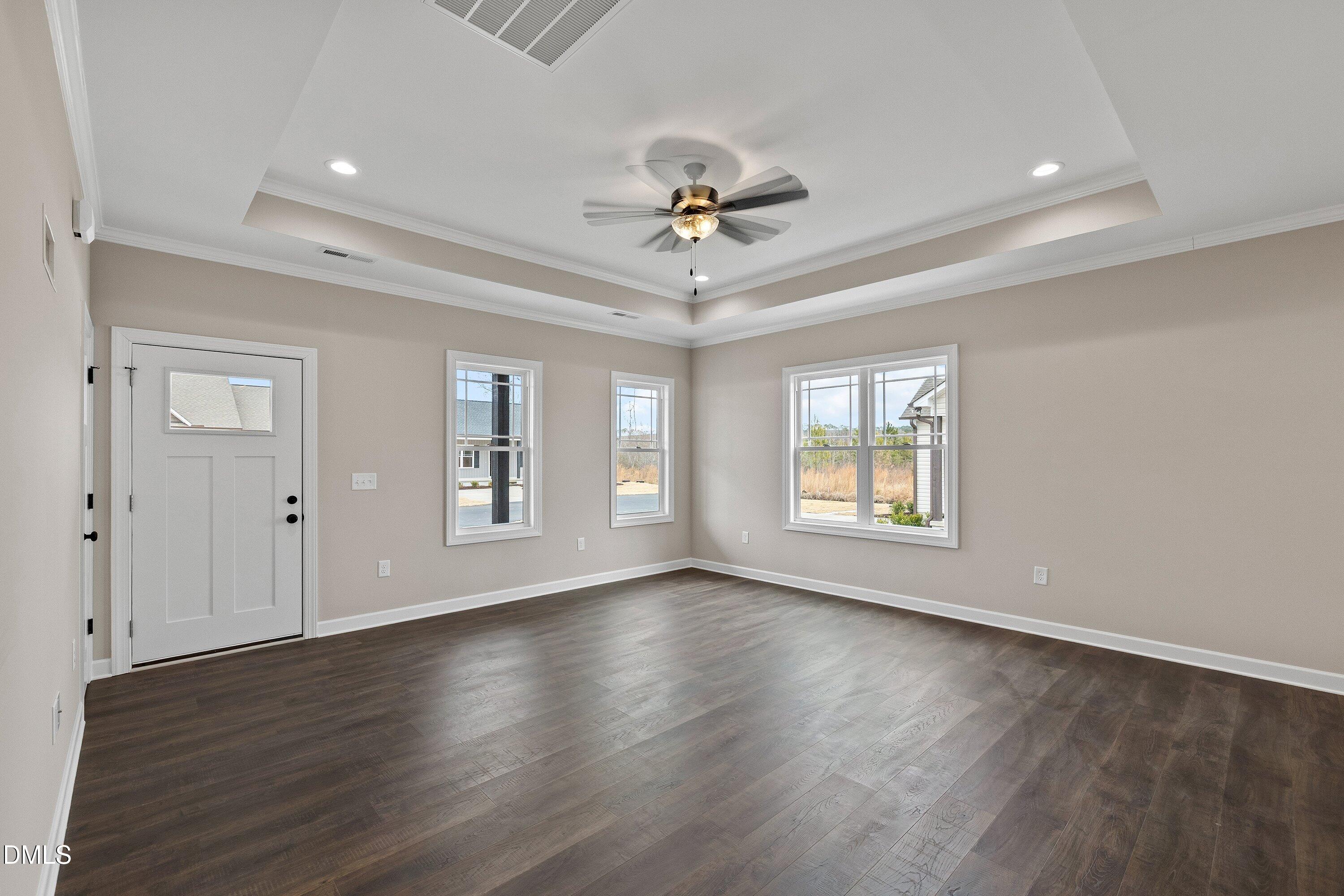 920 Micro Road West Selma, NC 27576 - Photo 9 of 32 a view of an empty room with wooden floor and a window