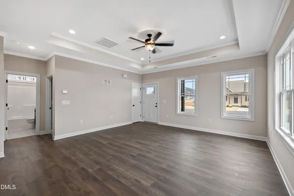 a large kitchen with stainless steel appliances granite countertop a sink a stove and a refrigerator