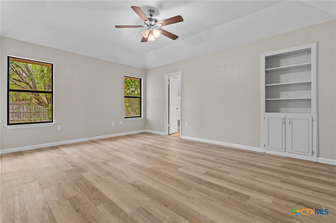 180 County Road 4933 Kempner, TX 76539 - Photo 14 of 24 a view of empty room with wooden floor and fan