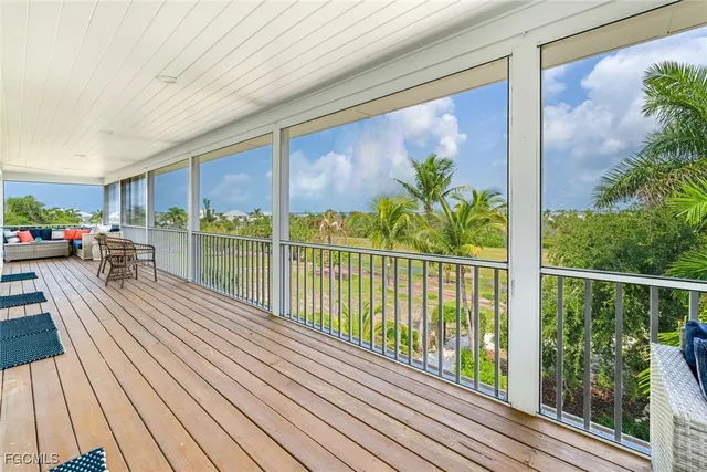 a view of a balcony with wooden floor and outdoor space