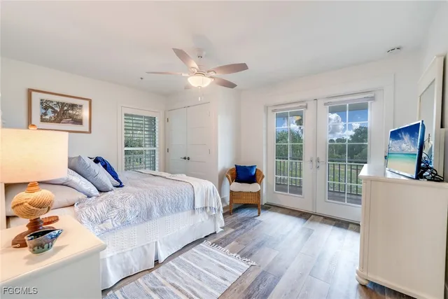 a spacious bathroom with a toilet a sink and a mirror