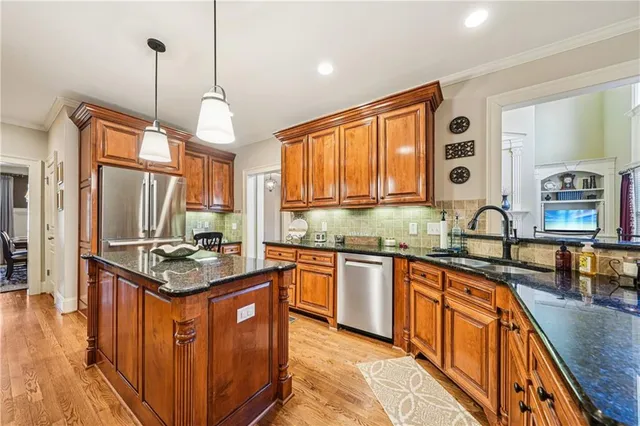 a spacious bathroom with a granite countertop sink mirror and bathtub