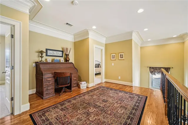 a living room with furniture a flat screen tv and a large window