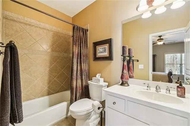 an aerial view of a house with a yard and lake view