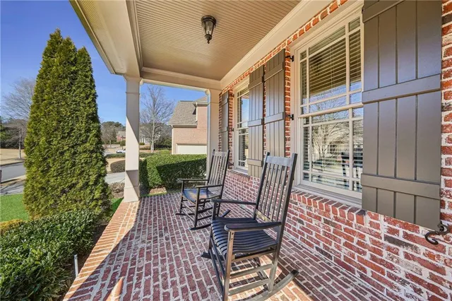 a view of balcony with wooden floor and outdoor seating