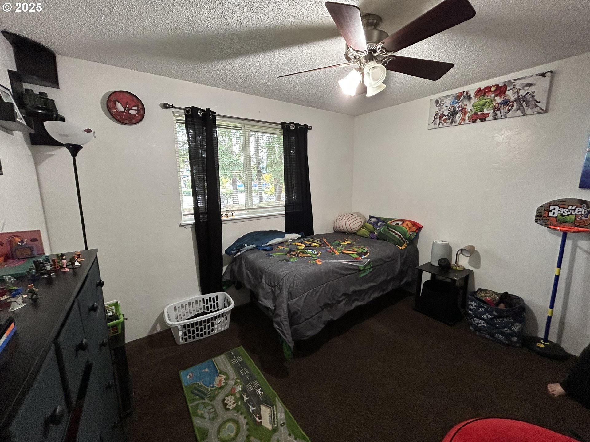 5495 A Units 69 70 71 72 Street Springfield, OR 97478 - Photo 11 of 13 a bedroom with a bed and a chandelier