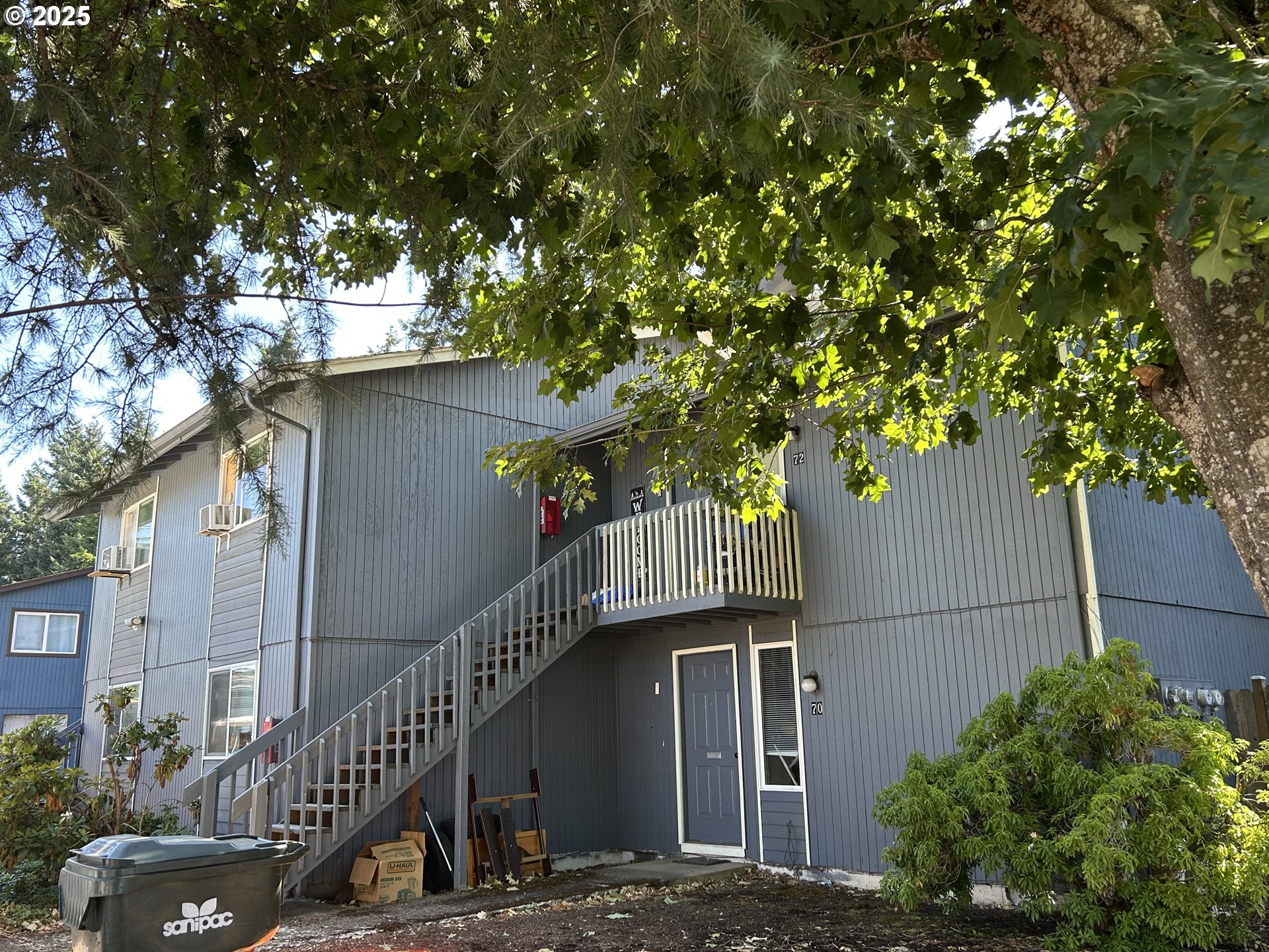5495 A Units 69 70 71 72 Street Springfield, OR 97478 - Photo 2 of 13 a view of balcony with plants and trees