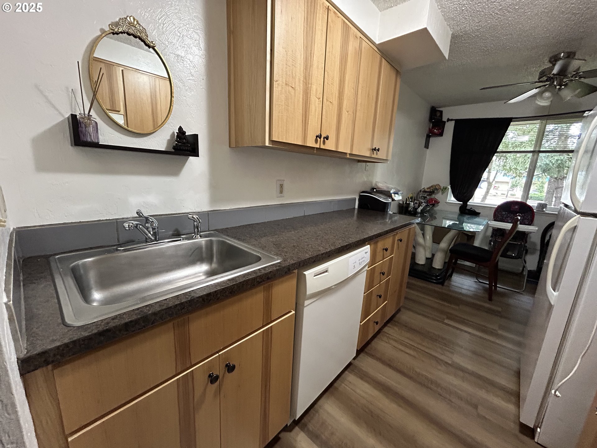 5495 A Units 69 70 71 72 Street Springfield, OR 97478 - Photo 6 of 13 a kitchen with granite countertop a sink a stove and cabinets