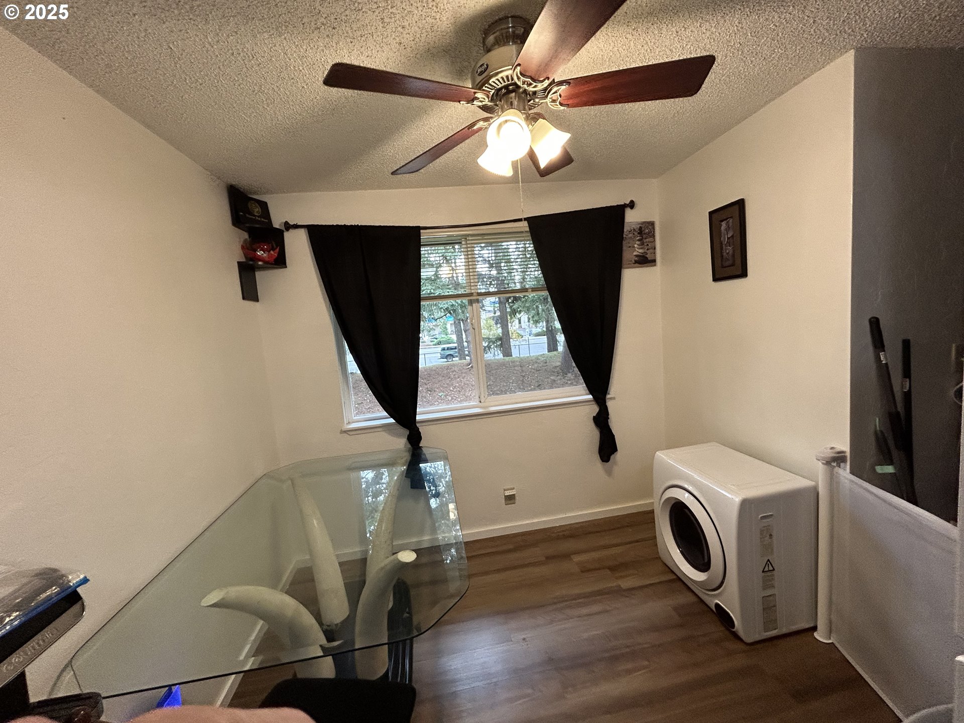 5495 A Units 69 70 71 72 Street Springfield, OR 97478 - Photo 7 of 13 a view of a livingroom with furniture washing machine and windows