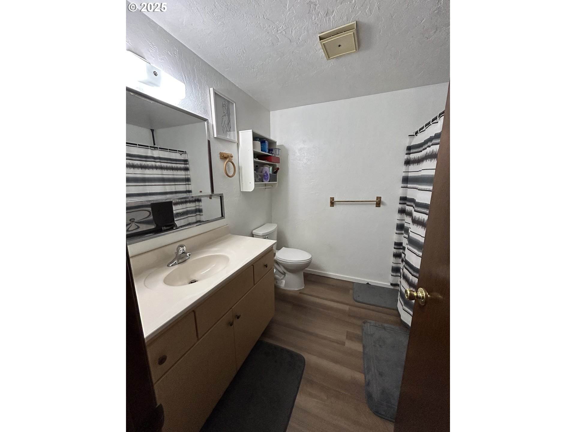 5495 A Units 69 70 71 72 Street Springfield, OR 97478 - Photo 9 of 13 a bathroom with a sink toilet double vanity and tub