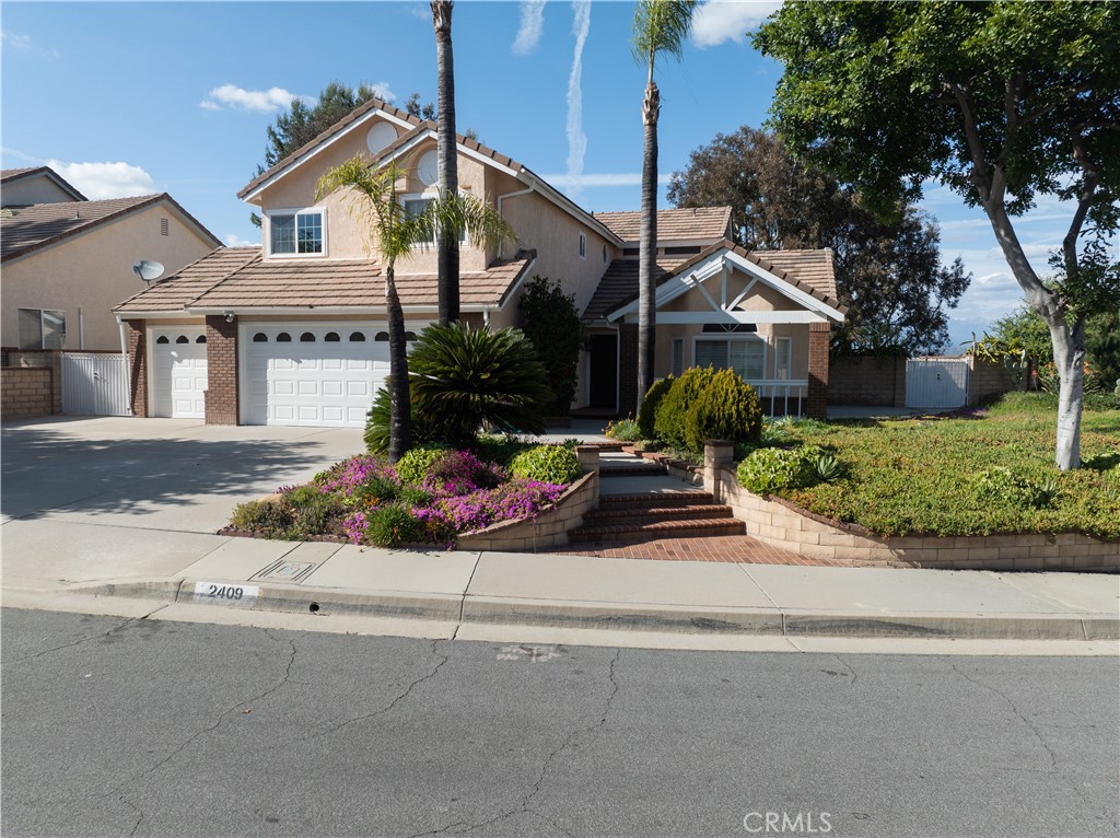 2409 Coraview Lane Rowland Heights, CA 91748 - Photo 15 of 23 front view of a house and a small yard