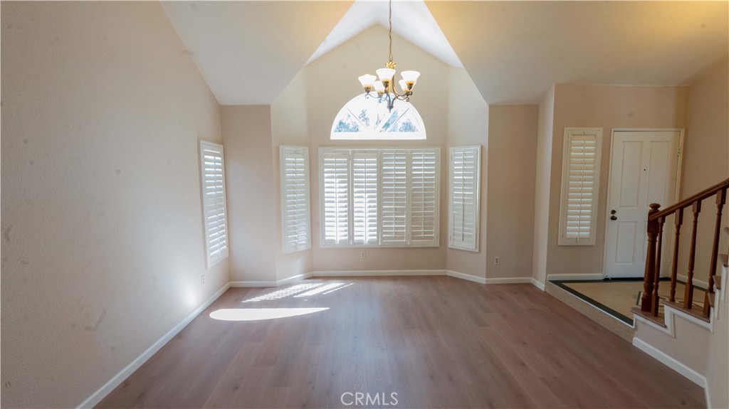 2409 Coraview Lane Rowland Heights, CA 91748 - Photo 4 of 23 an empty room with wooden floor and windows