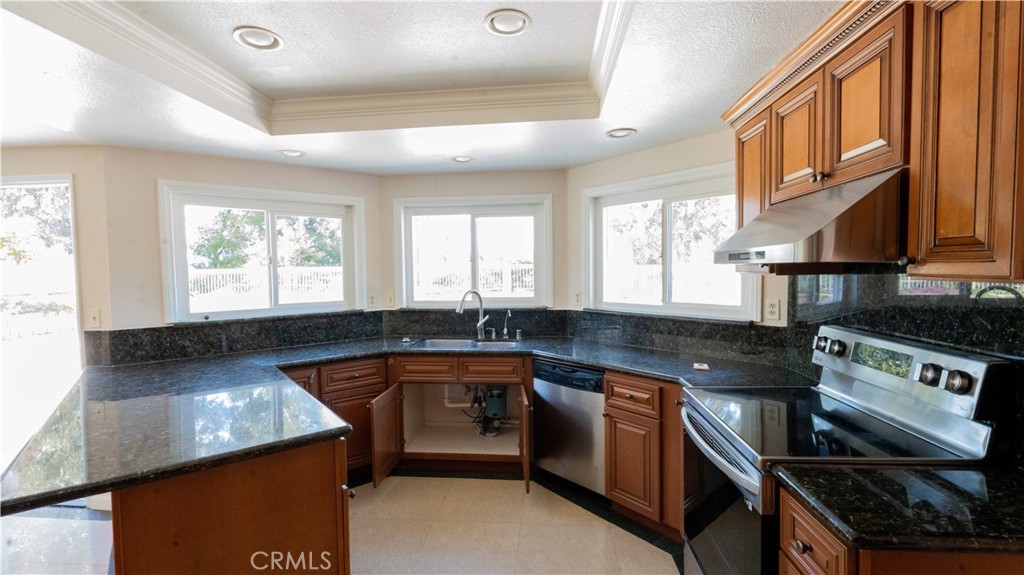 2409 Coraview Lane Rowland Heights, CA 91748 - Photo 5 of 23 a kitchen with a sink stove and cabinets