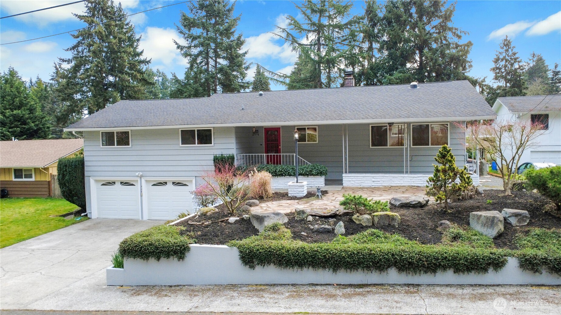 a front view of a house with garden