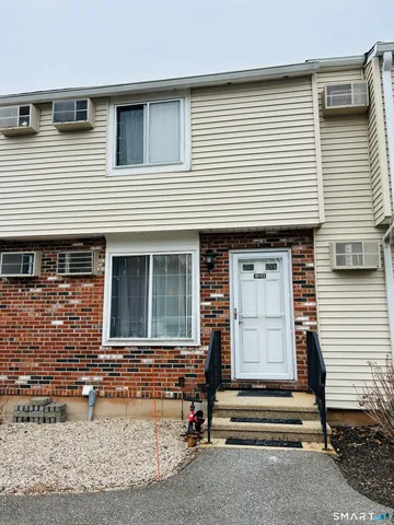 a front view of a house with a patio