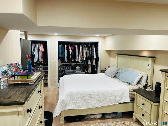 a bedroom with a bed and a dresser
