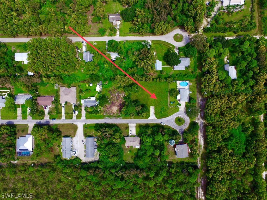 5478 Judith Road Bokeelia, FL 33922 - Photo 4 of 11 a aerial view of a house with an outdoor space and street view