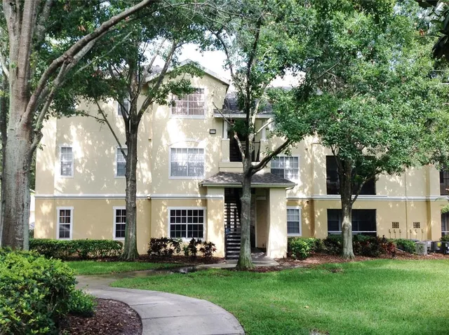 a view of a building with car parked