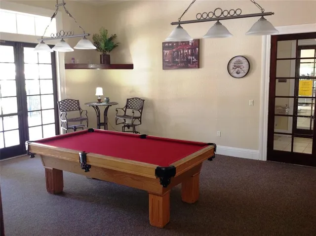 a view of a swimming pool with outdoor seating