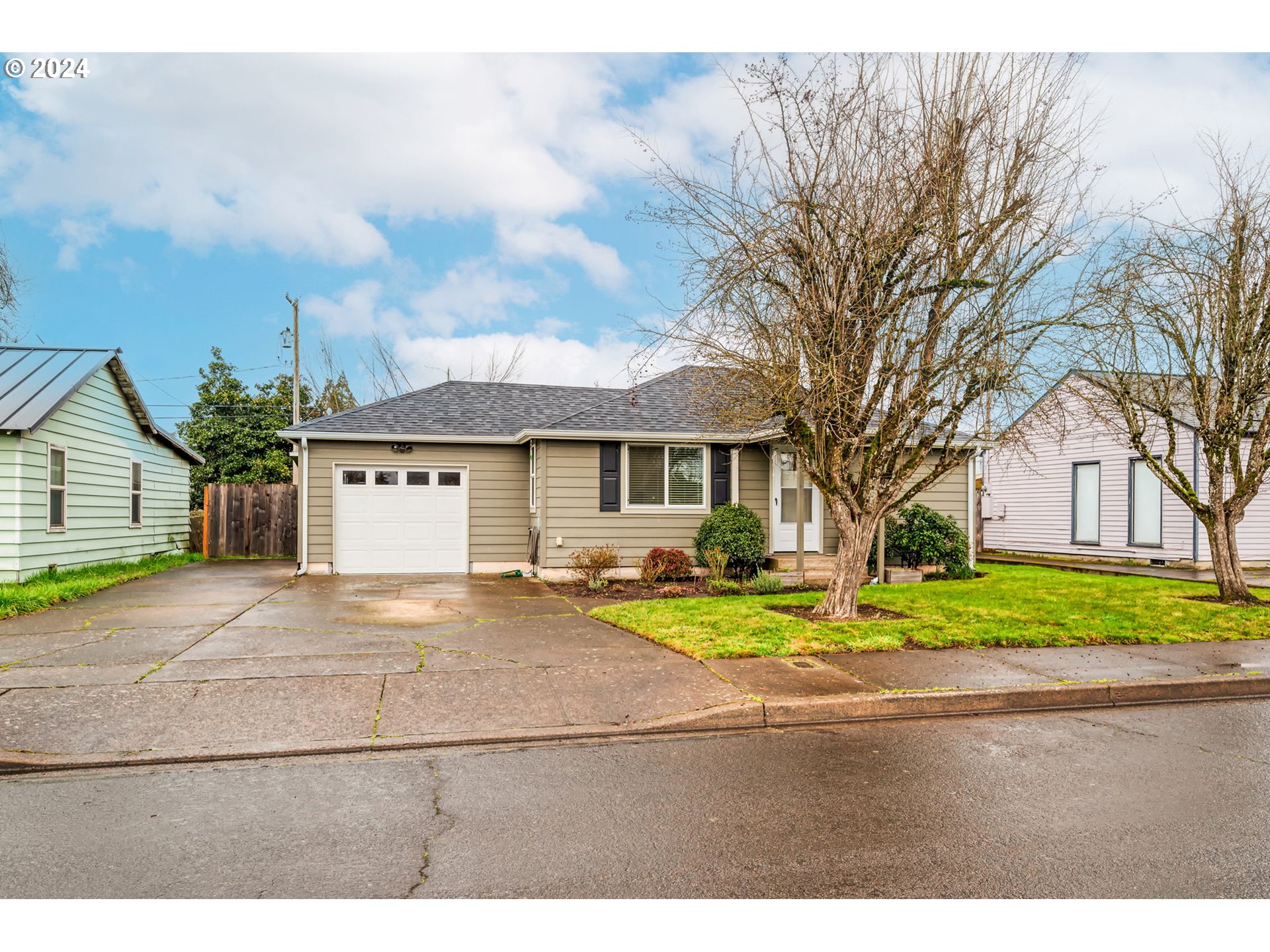 2700 C Street Springfield, OR 97477 - Photo 1 of 30 a front view of a house with a yard and garage