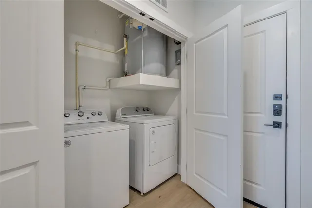 a bedroom with a large bed and a dresser