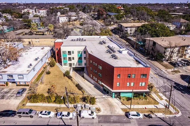 an aerial view of a house with a yard sitting space
